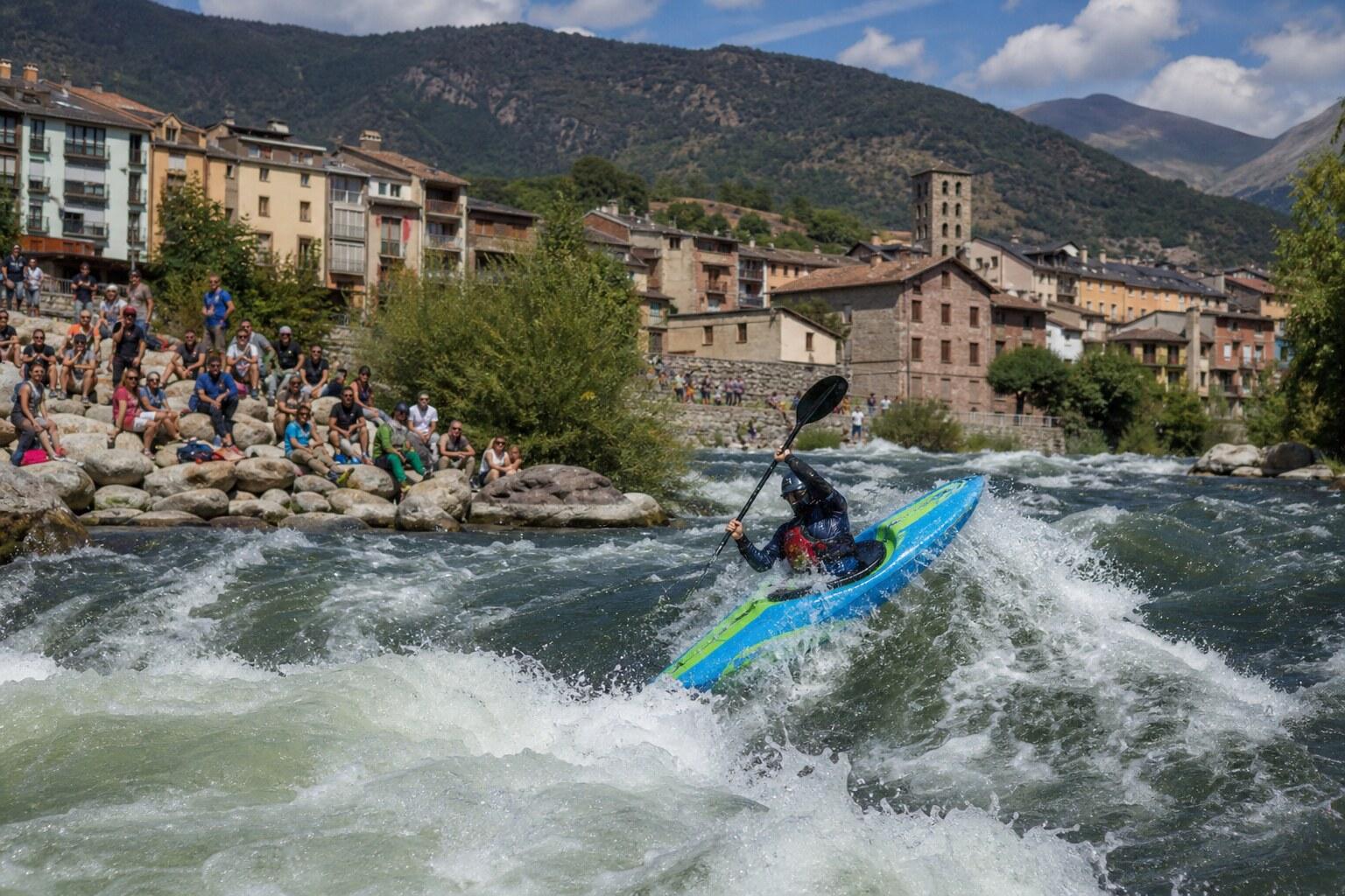 Freestyle kayaker competing on the river at Sort in the Catalan Pyrenees